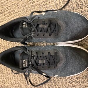 Worn womens Black and Gray Flex Experience Run 8 Sneakers